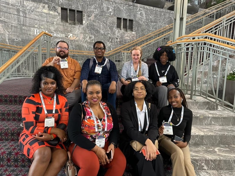 Groups of students sitting on a staircase.